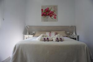 Voodi või voodid majutusasutuse Bright flat in Salinetas Beach toas