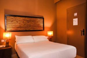 Postel nebo postele na pokoji v ubytování Chillout Hotel Tres Mares