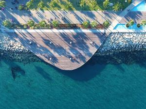 an aerial view of a pier over the water at Crowne Plaza Limassol by IHG in Limassol