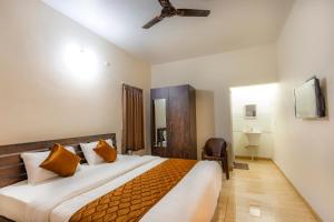 Ένα ή περισσότερα κρεβάτια σε δωμάτιο στο Orchid Elite Service apartments