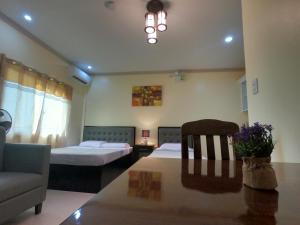 Postel nebo postele na pokoji v ubytování Mifaña Suites - Panglao Island
