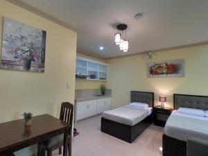 Postel nebo postele na pokoji v ubytování Mifaña Suites - Panglao Island