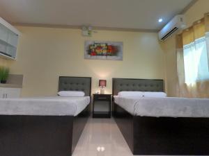 Postel nebo postele na pokoji v ubytování Mifaña Suites - Panglao Island