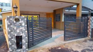a pair of gates in front of a house at Golden Hill 34 in Cameron Highlands