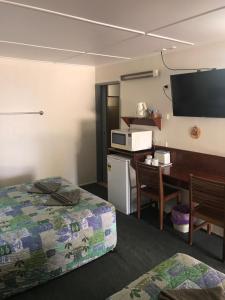Postel nebo postele na pokoji v ubytování Blackall Coolibah Motel + 1 fotografie