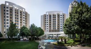 a view of two large buildings with a courtyard at Garden Court Sandton City in Johannesburg