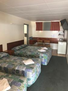 Postel nebo postele na pokoji v ubytování Blackall Coolibah Motel