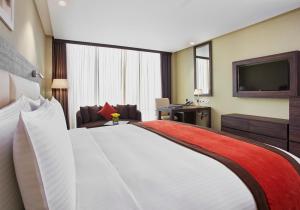 Krevet ili kreveti u jedinici u okviru objekta Crowne Plaza Kuwait Al Thuraya City, an IHG Hotel
