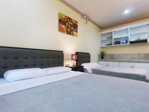 Postel nebo postele na pokoji v ubytování Mifaña Suites - Panglao Island