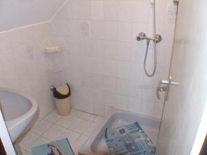a bathroom with a toilet and a sink and a tub at Katalin nyaraló in Balatonkeresztúr