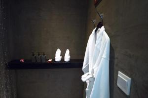 a bathroom with a towel hanging on a rack at Golden Temple Villa in Siem Reap