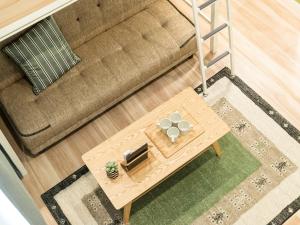 an overhead view of a coffee table in front of a couch at TRIP POD MINOSHIMA A in Fukuoka