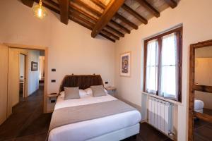 Borgo Degli Angeli Resort e Spa客房内的一张或多张床位