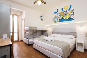 Postel nebo postele na pokoji v ubytování Hotel Albatros