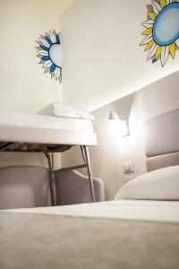 Postel nebo postele na pokoji v ubytování Hotel Albatros