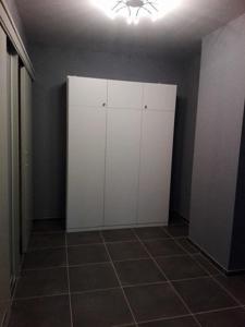 a room with a white cabinet and a tile floor at Osborne in Middelkerke