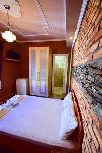 Postel nebo postele na pokoji v ubytování Menis Haus Rooms