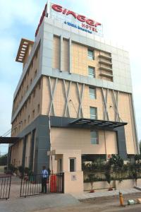 a man standing in front of a building at Ginger Lucknow in Lucknow