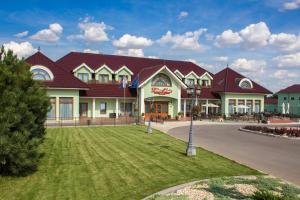 a large building with a red roof at Hotel Viliam Frano in Nitra