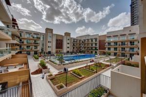 an apartment complex with a pool and a courtyard at bnbmehomes - Classic Studio Apt in the heart of JVC - 214 in Dubai