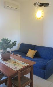 A seating area at Residence Marina di Carlino Tourist