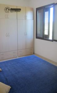 A bed or beds in a room at Residence Marina di Carlino Tourist