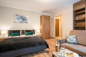 Posteľ alebo postele v izbe v ubytovaní AbsyntApartments Old Town Wroclaw