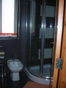 a bathroom with a shower and a toilet and a sink at Apartment in Marsaskala in Marsaskala