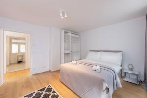 Uma cama ou camas num quarto em Vienna City Apartments Castelligasse
