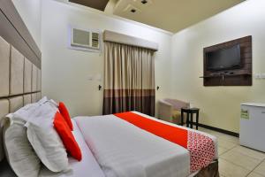 En eller flere senger på et rom på فندق نواميس للشقق المخدومه
