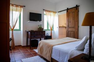 Giường trong phòng chung tại Vale De Ferreiros