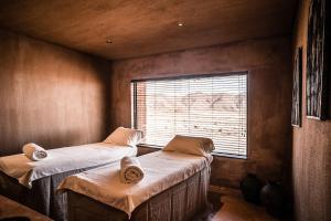 Postel nebo postele na pokoji v ubytování Zannier Sonop + 25 fotografií