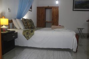 
Кровать или кровати в номере Zerof Guest House
