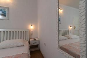 Postel nebo postele na pokoji v ubytování Rooms Feme