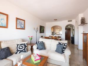 a living room with two white couches and a table at Apartment La joya by Interhome in Fuengirola