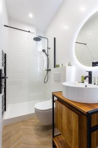 a bathroom with a sink and a toilet and a shower at Luxury home in paris in Paris