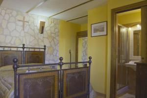 a bedroom with a bed and a walk in shower at Montanari Agrivillage in Narni
