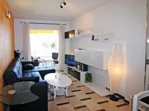 a living room with a couch and a table at Apartment Sol Y Mar by Interhome in Altea