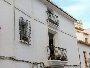 a white building with balconies and flowers on it at Apartment Albir by Interhome in Altea
