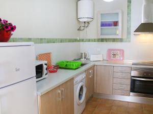 a kitchen with a white refrigerator and a dishwasher at Apartment Bella by Interhome in Altea