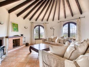 a living room with couches and a fireplace at Villa Tana by Interhome in Balcon del Mar