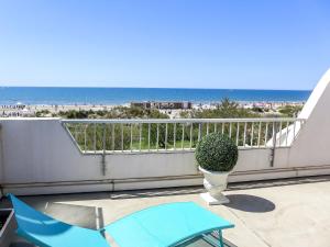 a balcony with a view of the beach at Apartment La Calypso-5 by Interhome in La Grande-Motte
