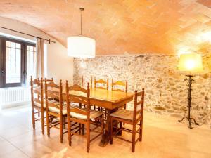 a dining room with a wooden table and chairs at Holiday Home La Tilia by Interhome in Calonge