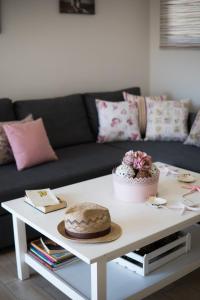 a white coffee table with a cake on top of it at Velanidia Apartments in Plataria