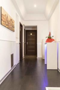 an empty room with a hallway with a door at Imperial Suite Guest House in Rome