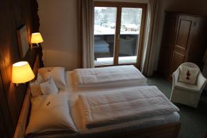 Letto o letti in una camera di Pension Feiersinger