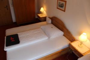 Letto o letti in una camera di Pension Feiersinger