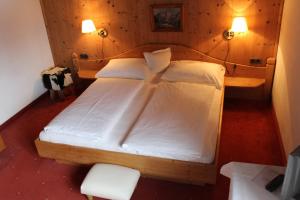 Letto o letti in una camera di Pension Feiersinger