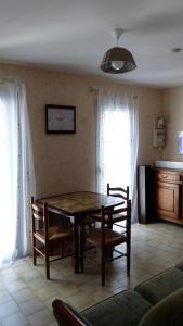 a dining room with a table and some chairs at PIED A TERRE 4 in Amélie-les-Bains-Palalda +11 photos
