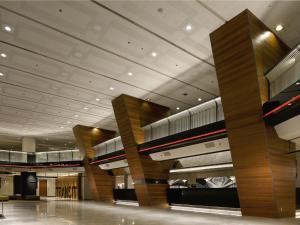 a lobby of a building with a train on the ceiling at Hotel Nikko Narita in Narita